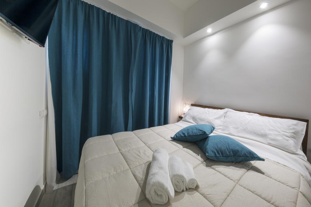 Piazza Martiri Rooms Кальярі Номер фото